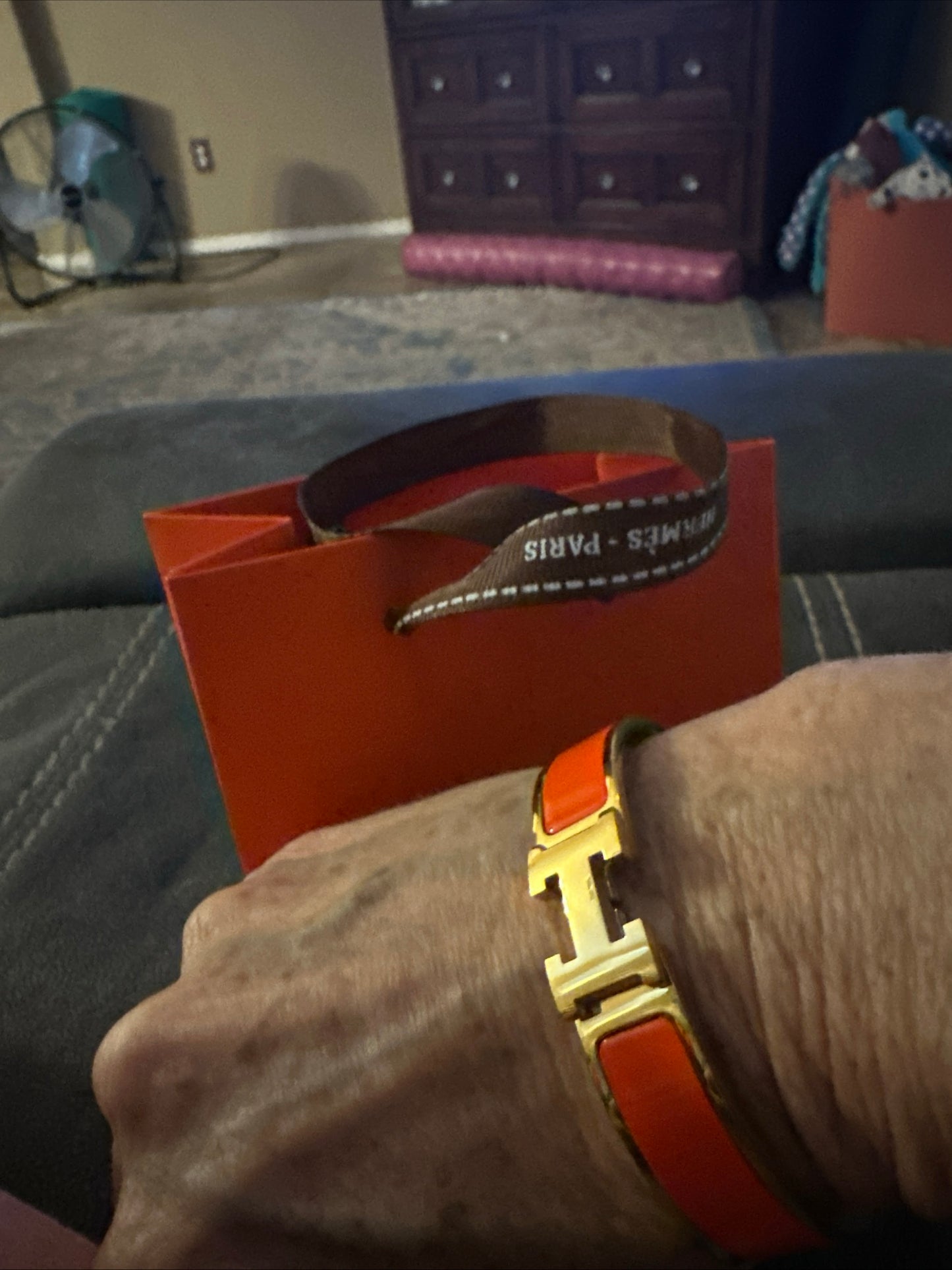 H Clic bracelet, yellow gold plated with bright orange coated enamel