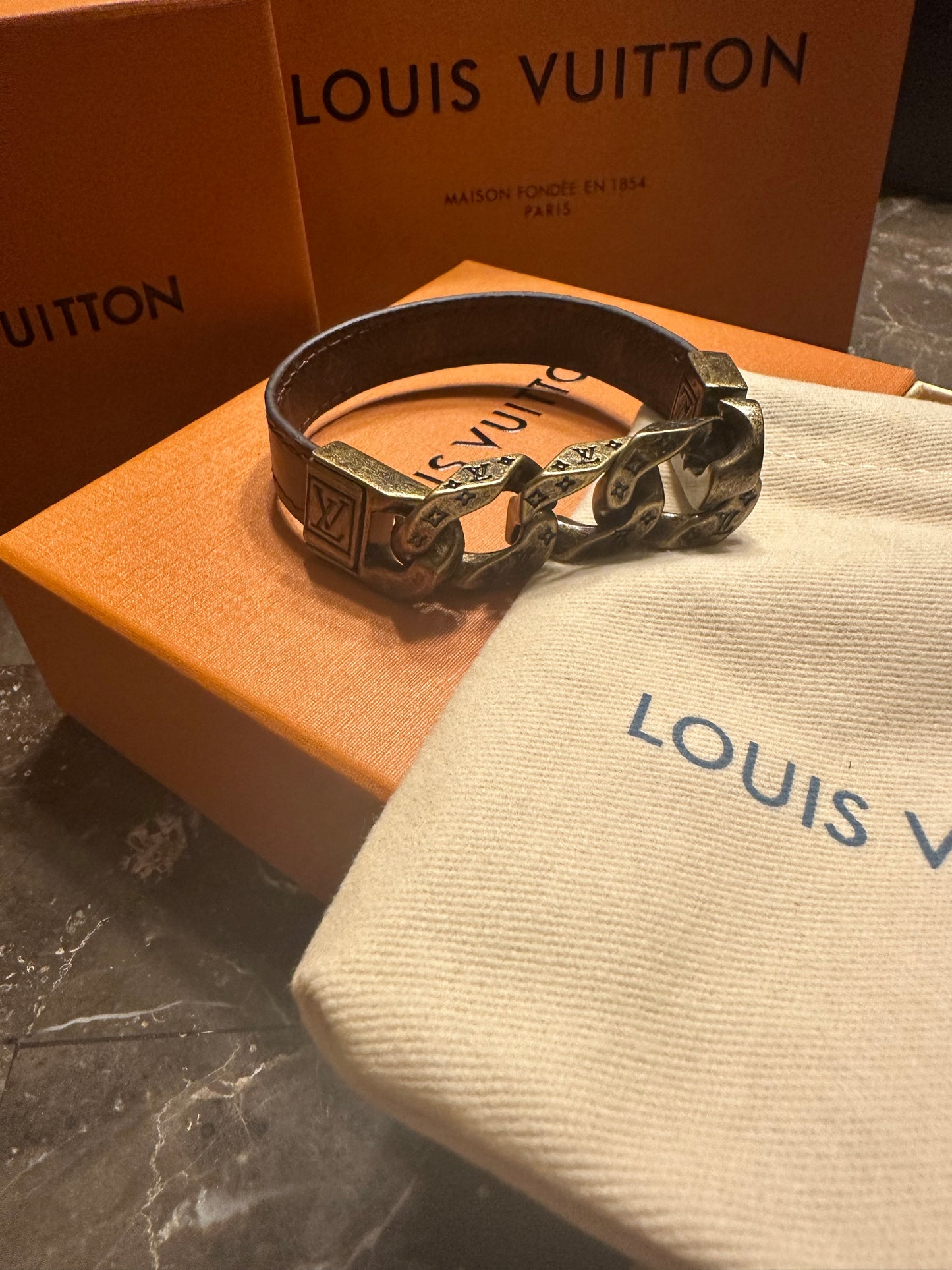 Louis Vuitton bracelet, brown leather and gold links