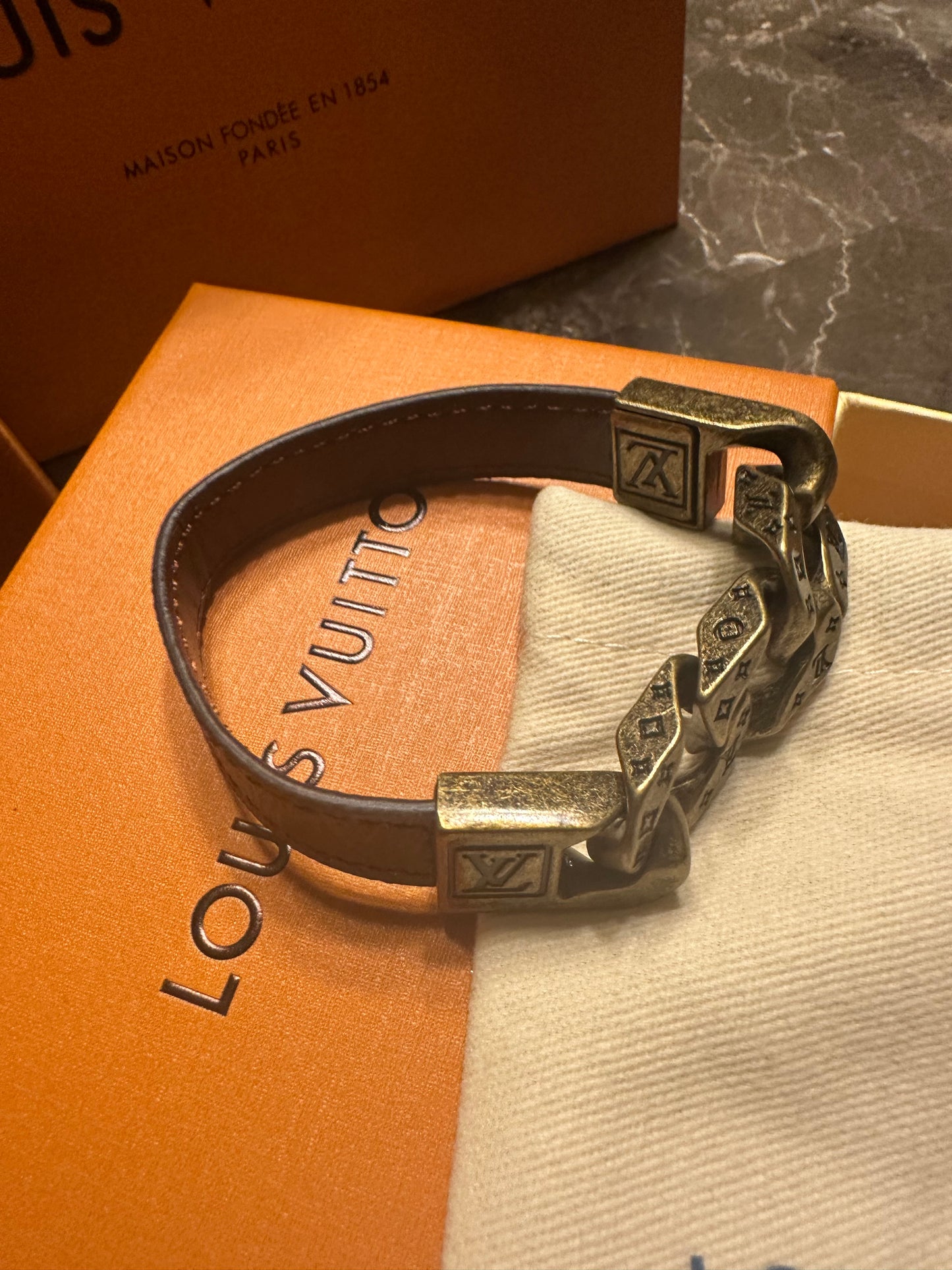 Louis Vuitton bracelet, brown leather and gold links