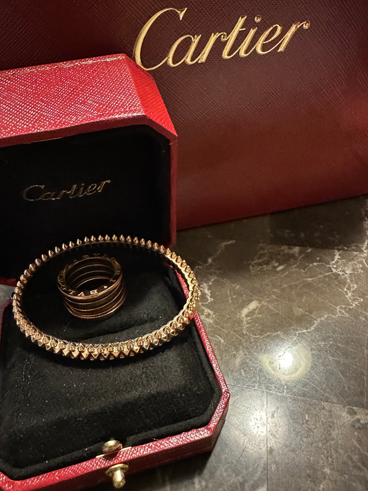 Cartier bullet design, rose gold. Pictured with Bulgari rose ring, size 6, not included.