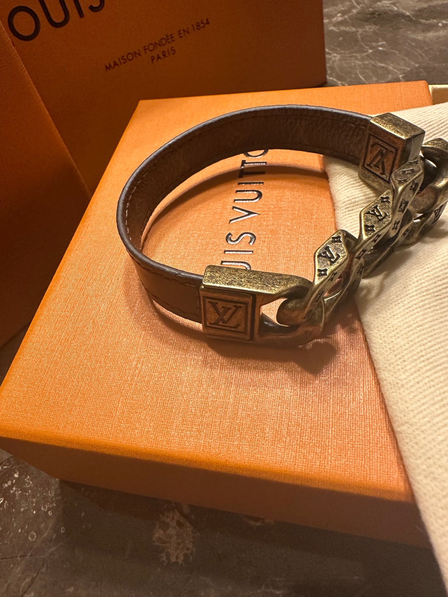 Louis Vuitton bracelet, brown leather and gold links