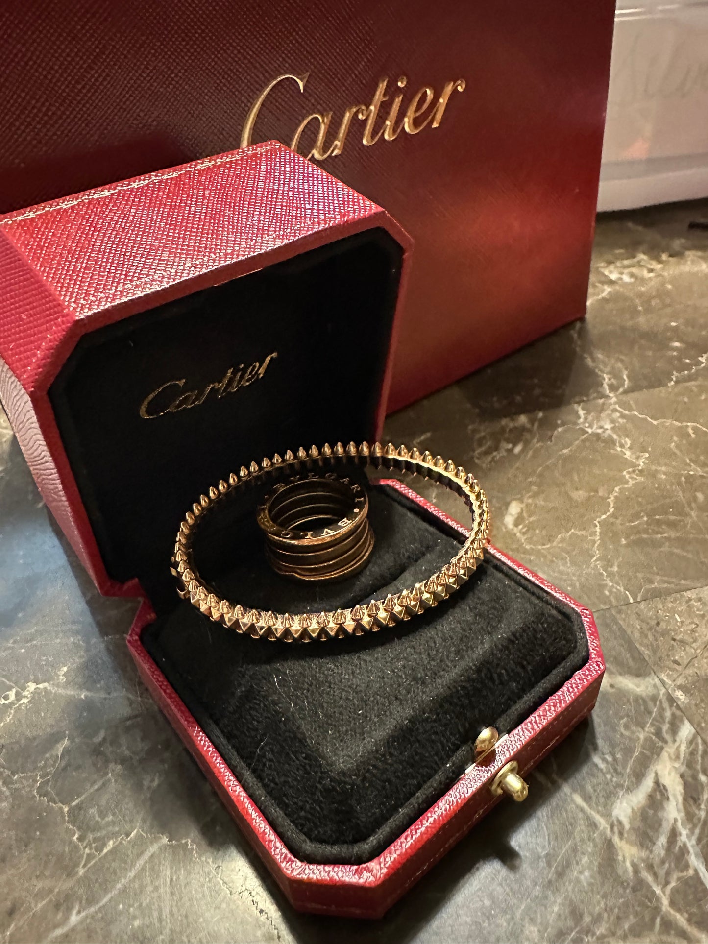 Cartier bullet design, rose gold. Pictured with Bulgari rose ring, size 6, not included.