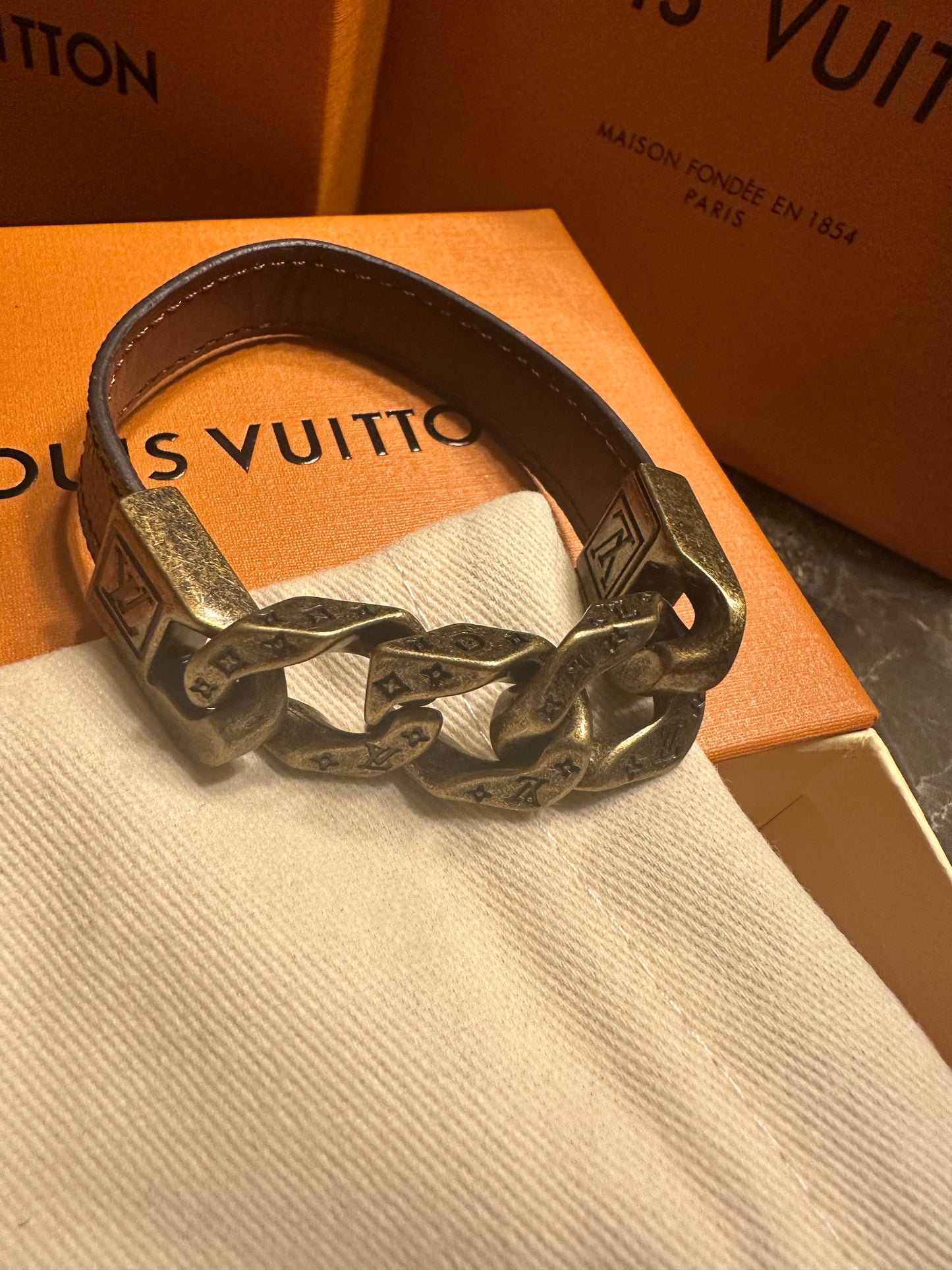 Louis Vuitton bracelet, brown leather and gold links